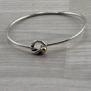 Tiffany & Co. 9.25 & 750 Yellow Love Knot Bracelet.